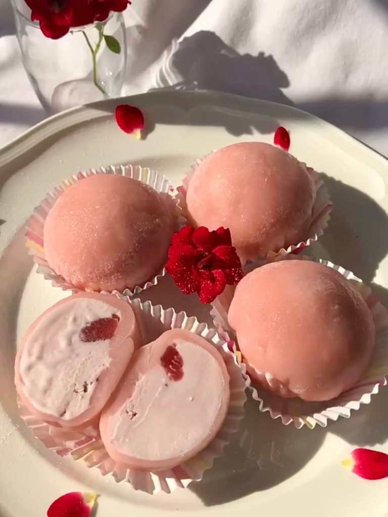 strawberry ice cream mochi on white plate