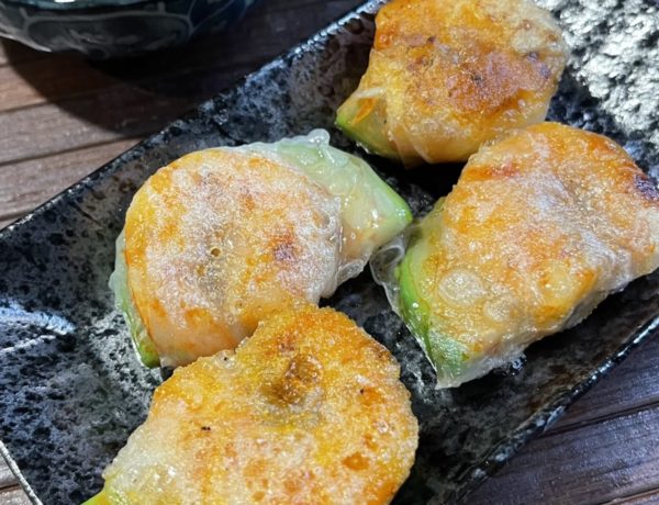 crispy shrimp rice paper bites on black plate